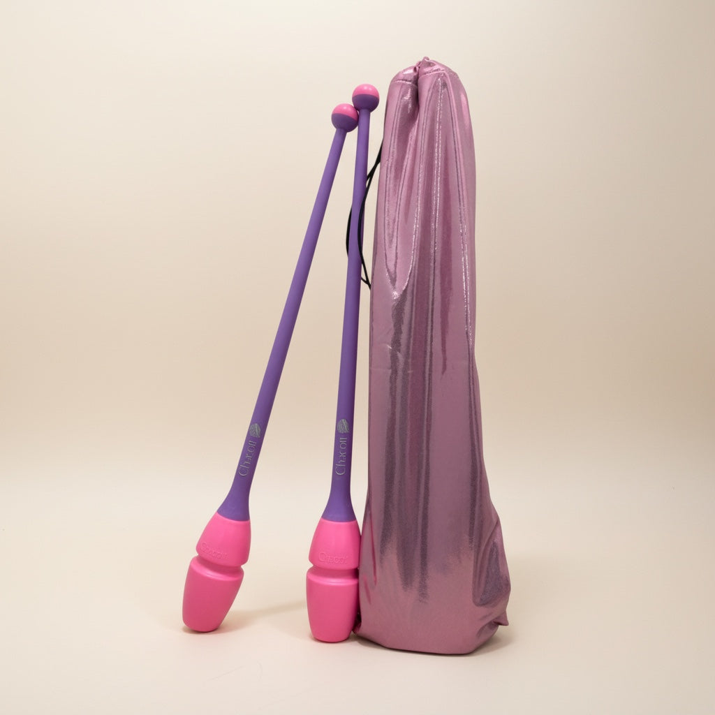 Purple and pink clubs with carrying bag on a beige background