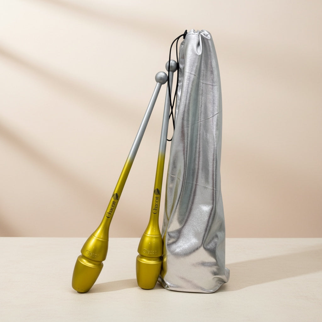 Gold and silver clubs with a silver carrying bag on a beige background