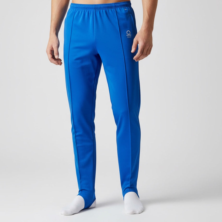 Blue athletic pants worn by a person on a white background