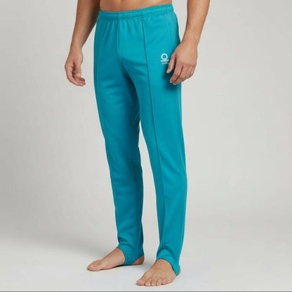 Teal swim pants with a logo on a gray background