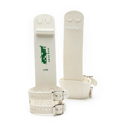 A pair of Reisport women's uneven bars grips with hook and loop closures, predominantly white with green and black branding.