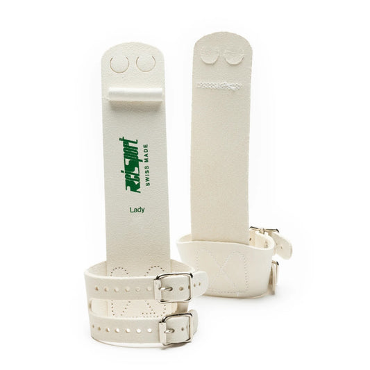 A pair of Reisport women's uneven bars grips with hook and loop closures, predominantly white with green and black branding.