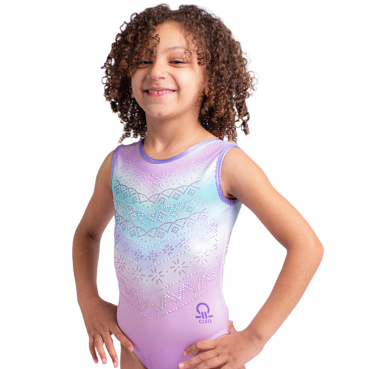 Young girl wearing a colorful leotard on a white background