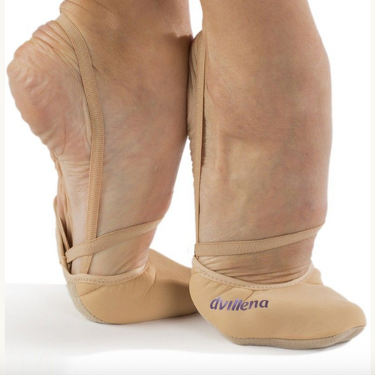 Beige ballet shoes with a visible brand logo on a white background