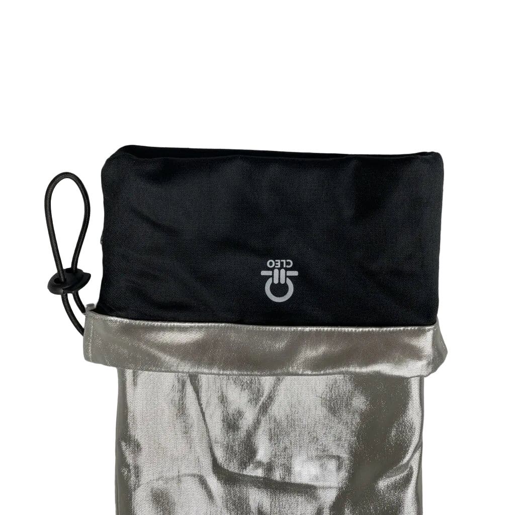 Black drawstring bag with silver top section on a light gray background