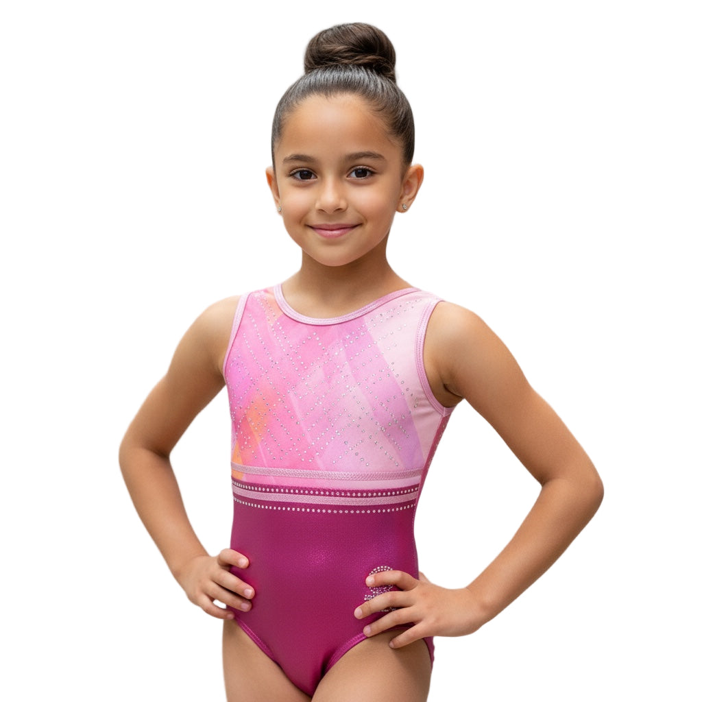 Young girl wearing a pink and purple leotard against a gray background