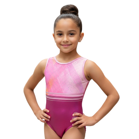Young girl wearing a pink and purple leotard against a gray background
