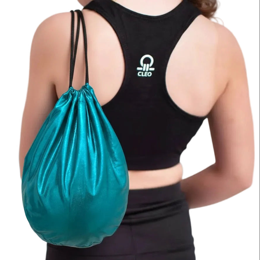 Person wearing a black sports bra with a logo and holding a teal drawstring bag on a white background
